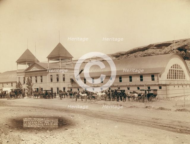 Hot Springs, SD Exterior view of largest plunge bath house in US on FE and MV R'y, 1891. Creator: John C. H. Grabill.