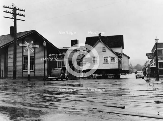 House being moved through the main street of town..., Cottage Grove, Lane County, Oregon, 1939. Creator: Dorothea Lange.