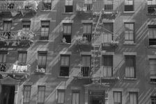 House fronts, 61st Street between 1st and 3rd Avenues, New York, 1938. Creator: Walker Evans