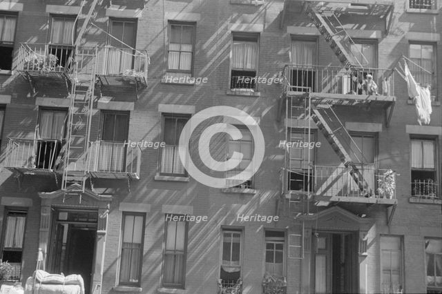 House fronts, 61st Street between 1st and 3rd Avenues, New York, 1938. Creator: Walker Evans.