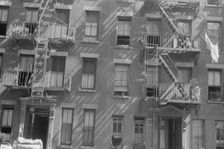 House fronts, 61st Street between 1st and 3rd Avenues, New York, 1938. Creator: Walker Evans