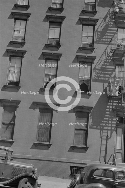 House fronts, 61st Street between 1st and 3rd Avenues, New York, 1938. Creator: Walker Evans.
