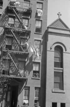 House fronts, 61st Street between 1st and 3rd Avenues, New York, 1938. Creator: Walker Evans