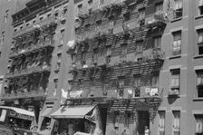 House fronts, 61st Street between 1st and 3rd Avenues, New York, 1938. Creator: Walker Evans