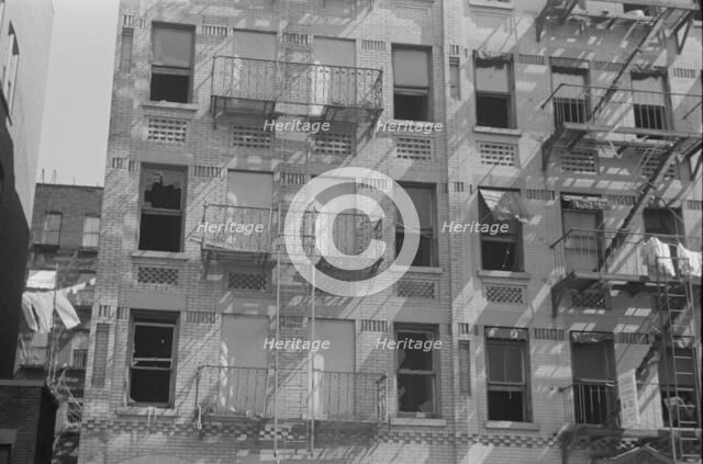 House fronts, 61st Street between 1st and 3rd Avenues, New York, 1938. Creator: Walker Evans.