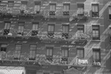 House fronts, 61st Street between 1st and 3rd Avenues, New York, 1938. Creator: Walker Evans
