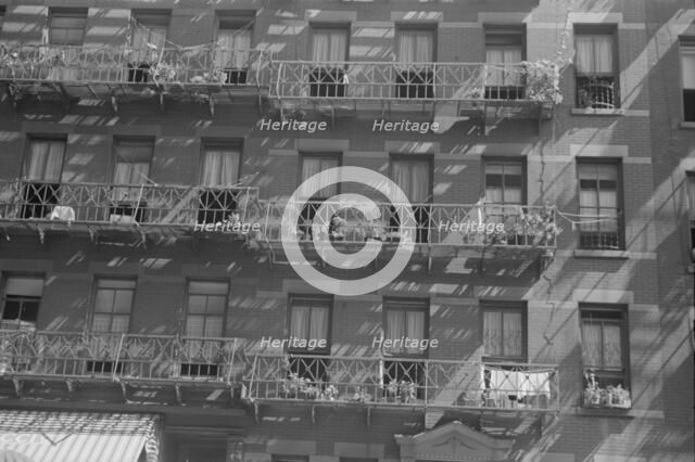 House fronts, 61st Street between 1st and 3rd Avenues, New York, 1938. Creator: Walker Evans.