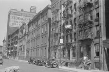 House fronts, 61st Street between 1st and 3rd Avenues, New York, 1938. Creator: Walker Evans