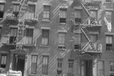 House fronts, 61st Street between 1st and 3rd Avenues, New York, 1938. Creator: Walker Evans