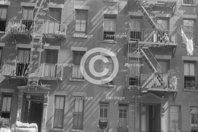 House fronts, 61st Street between 1st and 3rd Avenues, New York, 1938. Creator: Walker Evans.