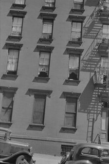 House fronts, 61st Street between 1st and 3rd Avenues, New York, 1938. Creator: Walker Evans