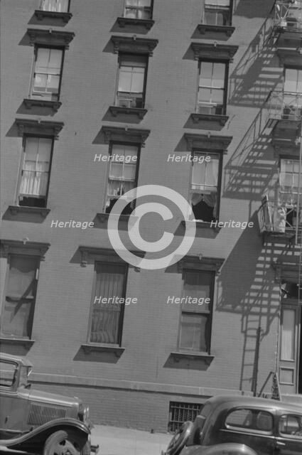 House fronts, 61st Street between 1st and 3rd Avenues, New York, 1938. Creator: Walker Evans.