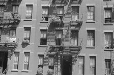 House fronts, 61st Street between 1st and 3rd Avenues, New York, 1938. Creator: Walker Evans