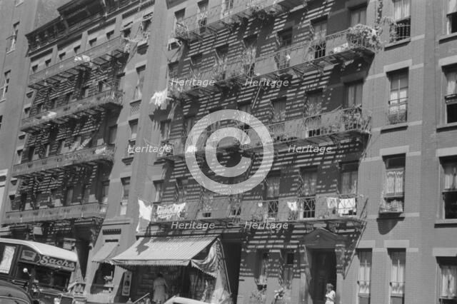 House fronts, 61st Street between 1st and 3rd Avenues, New York, 1938. Creator: Walker Evans.