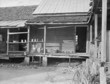 House in which cotton farmer has lived for fifty years, Macon County, Georgia, 1937. Creator: Dorothea Lange