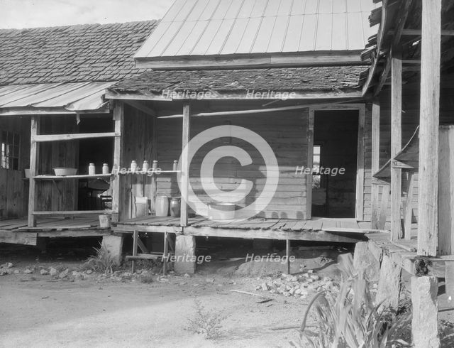 House in which cotton farmer has lived for fifty years, Macon County, Georgia, 1937. Creator: Dorothea Lange.