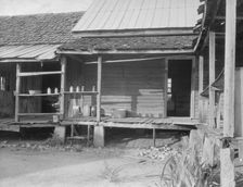 House in which cotton farmer has lived for fifty years, Macon County, Georgia, 1937. Creator: Dorothea Lange