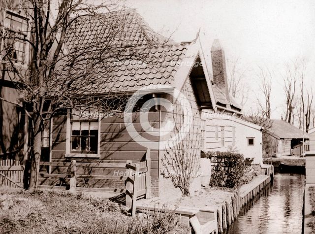 House on a canal bank, Broek, Netherlands, 1898.Artist: James Batkin