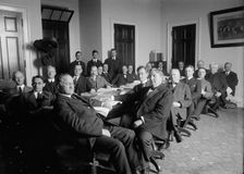 House of Representatives Committees - Agriculture. in Front of Table: Reps. Lever..., 1914 or 1916. Creator: Harris & Ewing