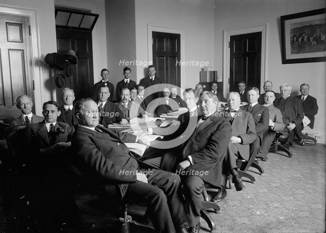 House of Representatives Committees - Agriculture. in Front of Table: Reps. Lever..., 1914 or 1916. Creator: Harris & Ewing.