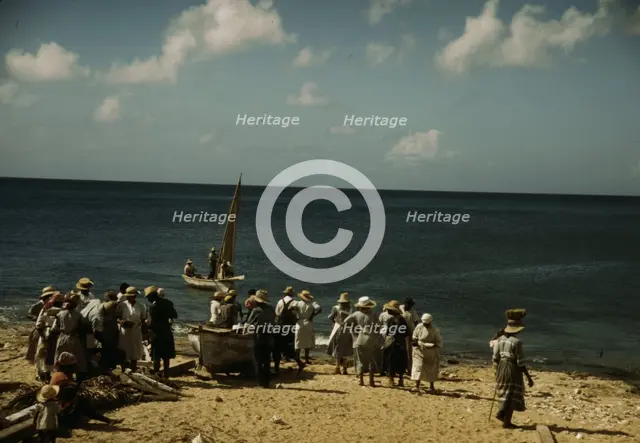 Housewives at the seashore waiting for the fishing boats to come in Frederiksted, V.I., 1941. Creator: Jack Delano.