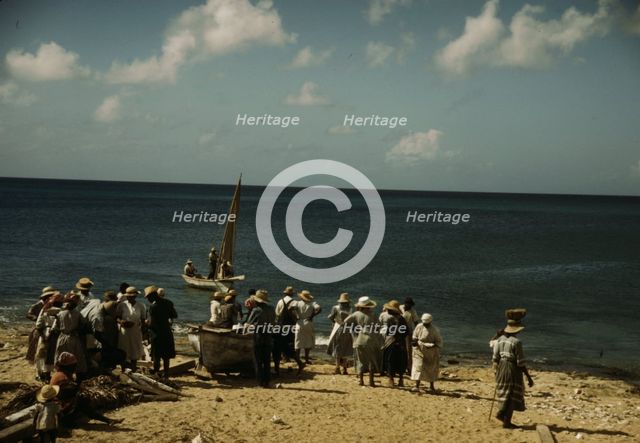 Housewives at the seashore waiting for the fishing boats to come in Frederiksted, V.I., 1941. Creator: Jack Delano.