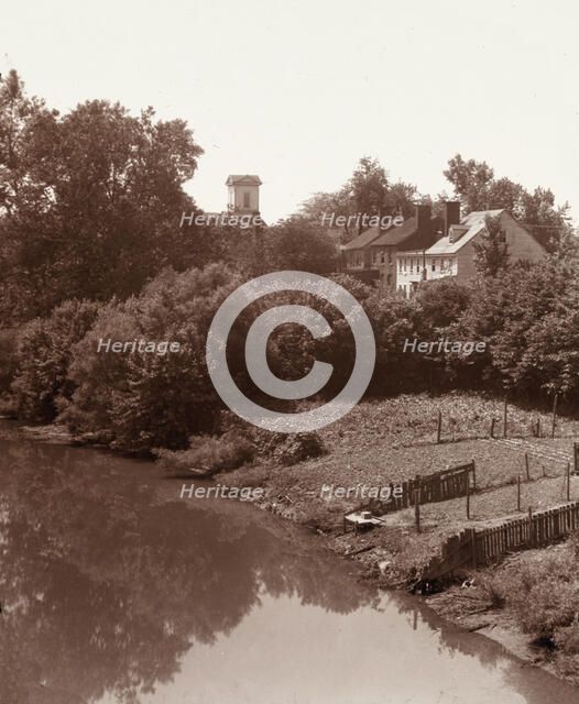 Houses on Water Street, from the bridge, Fredericksburg, Virginia, between 1927 and 1929. Creator: Frances Benjamin Johnston.