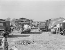 Housing for migratory workers in cotton, five miles north of Corcoran, California, 1936. Creator: Dorothea Lange