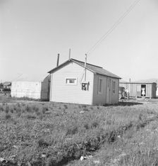 Housing for rapidly growing settlement of lettuce workers on fringes of town, Salinas, CA, 1939. Creator: Dorothea Lange