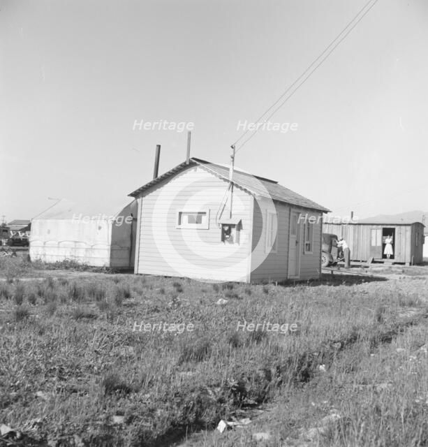 Housing for rapidly growing settlement of lettuce workers on fringes of town, Salinas, CA, 1939. Creator: Dorothea Lange.