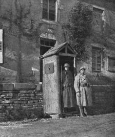 Hours of Victory; American sentry and French sentry at the entrance to a village..., 1917. Creator: Unknown