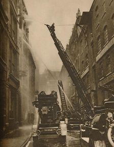 How The London Fire Brigade Comes To Grips With Its Enemy c1935. Creator: Unknown