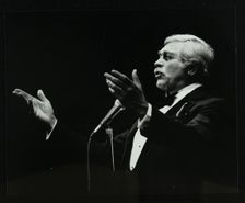 Howard Keel in full song at the Forum Theatre, Hatfield, Hertfordshire, 14 May 1983. Creator: Denis Williams