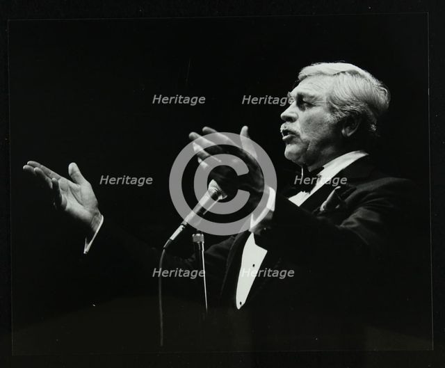 Howard Keel in full song at the Forum Theatre, Hatfield, Hertfordshire, 14 May 1983. Creator: Denis Williams.