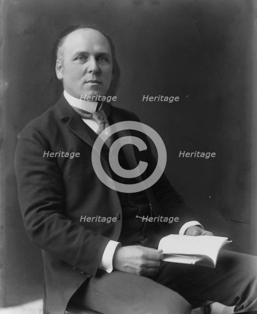Howard Pyle, three-quarter length portrait, seated, facing slightly right, c1897. Creator: Frances Benjamin Johnston.