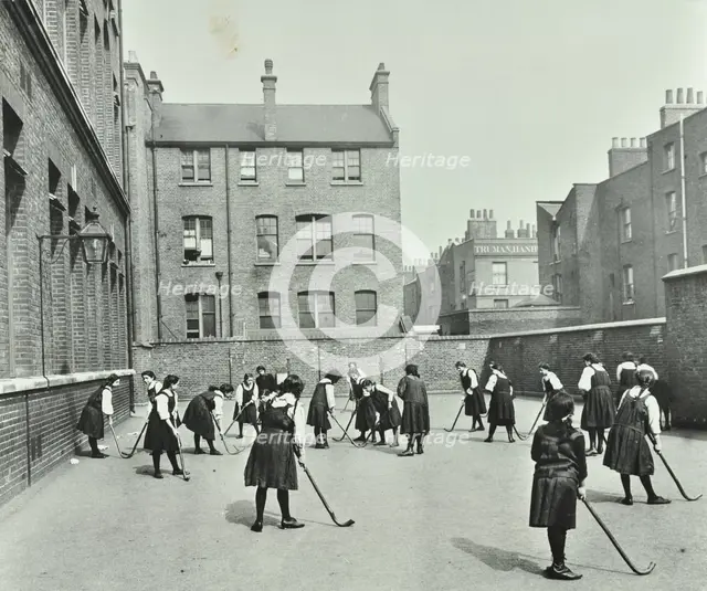 Hockey game, Myrdle Street Girls School, Stepney, London, 1908. Artist: Unknown.