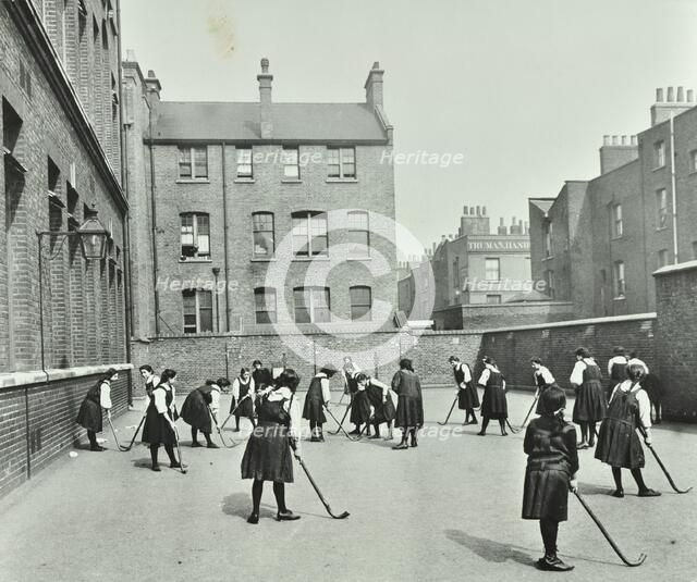Hockey game, Myrdle Street Girls School, Stepney, London, 1908. Artist: Unknown.