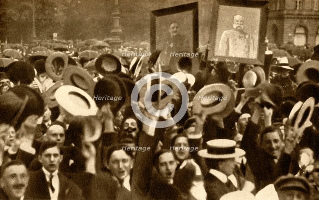 'Hoch the Kaiser!': cheering crowds in the streets, Berlin, Germany, 4 August 1914, (1933).  Creator: Unknown.