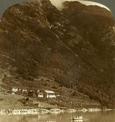 Hogrending farm, nestling at the mountain's base, on the E. shore of Lake Loen, Norway c1905. Creator: Unknown