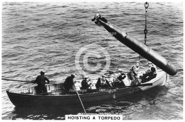 Hoisting a torpedo, HMS 'Courageous', 1937. Artist: Unknown