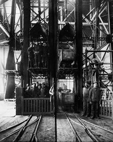 Hoisting ore & lowering miners, Lead Homestake Mine, between 1900 and 1910. Creator: William H. Jackson