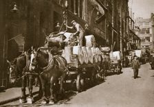 Hoisting the paper into a newspaper office, 20th century. Creator: Unknown