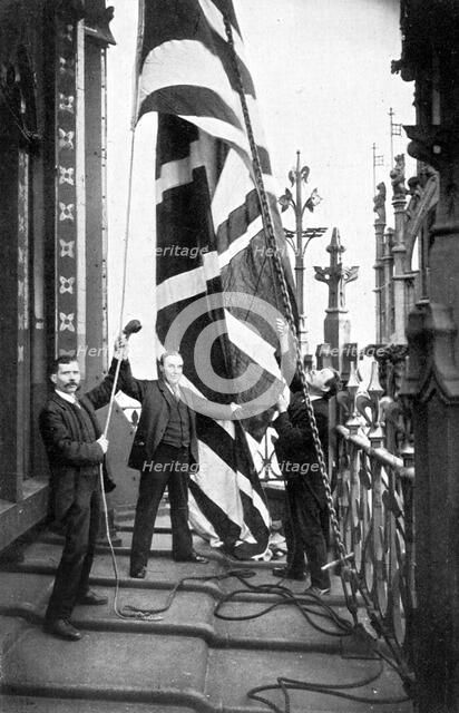 Hoisting the Union Jack, Houses of Parliament, Westminster, c1905. Artist: Unknown