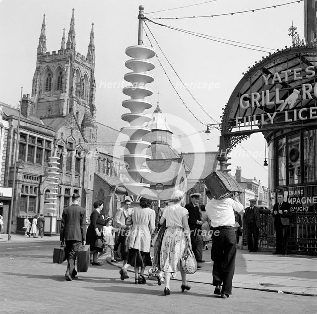 Holidaymakers make their way towards Talbot Road Station, Blackpool, c1946-c1955. Artist: John Gay