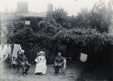 Holmleigh Auxiliary Military Hospital, Harrow: a nurse and two soldiers, one of whom has..., c1922. Creator: Unknown