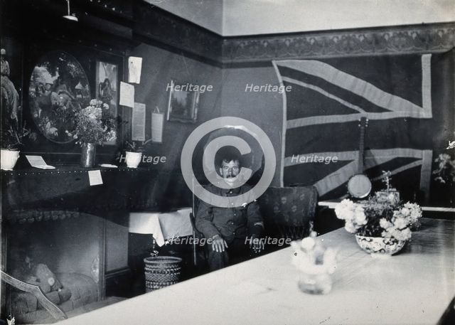 Holmleigh Auxiliary Military Hospital, Harrow: a soldier with amnesia sitting in a room..., c1922. Creator: Unknown.