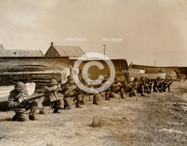 Holy Island fishermen Home Guards rifle practice, Lindisfarne, Northumberland, World War II, 1942. Artist: Unknown