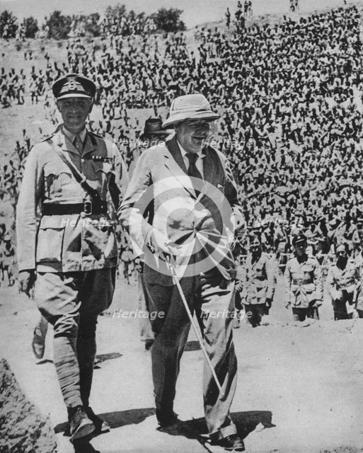 'Home via the Battlefields - Mr Churchill in the ancient Roman amphitheatre at Carthage', 1943-44. Artist: Unknown.