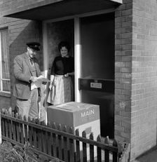 Home delivery of a cooker, Darfield, Barnsley, South Yorkshire, 1963. Creator: Michael Walters