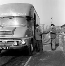 Home delivery of a cooker, Darfield, Barnsley, South Yorkshire, 1963. Creator: Michael Walters